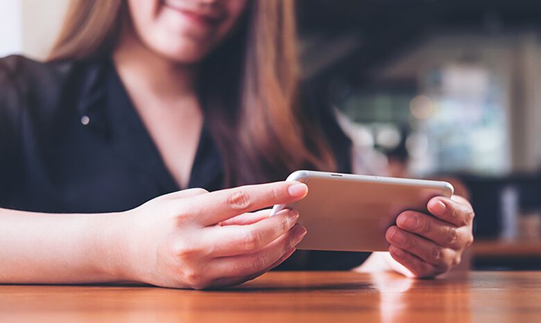 Woman watching show on mobile - Streaming Services | MyRepublic